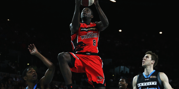 Perth's James Ennis soars to the rim during his side's clash with the Breakers at Vector Arena tonight. Photo / Getty