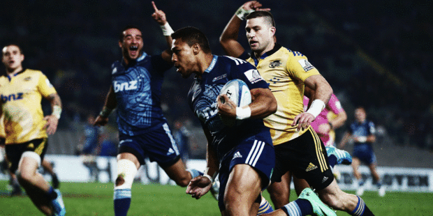 George Moala races away to score the Blues' bonus-point try during their impressive win over the Hurricanes. Photo / Getty