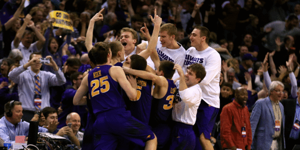 Paul Jesperson #4 of the Northern Iowa Panthers celebrates with his teammates after hitting a half court three pointer at the buzzer. Photo / Getty Images.