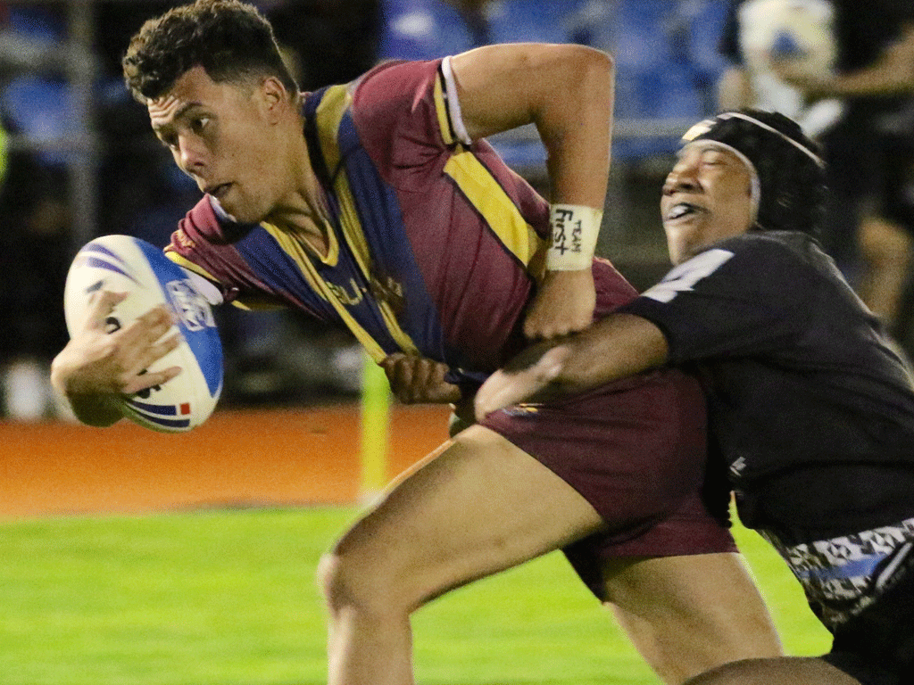 St Paul's fullback Star Toa carries a Wesley defender over the the try-line to score. Photo / Auckland Rugby League.