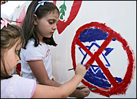 Children in Jordan deface a painting of the Israeli flag during a protest against the strikes on Lebanon. Picture / Reuters Children in Jordan deface a painting of the Israeli flag during a protest against the strikes on Lebanon. Picture / Reuters