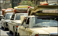 Displaced south Lebanon citizens sit in cars on their way to Tayba. Picture / Reuters Displaced south Lebanon citizens sit in cars on their way to Tayba. Picture / Reuters
