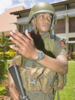 A soldier removes members of the Fiji Senate. Photo / Greg Bowker A soldier removes members of the Fiji Senate. Photo / Greg Bowker