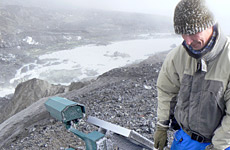 Scientist Dr Vern Manville retrieves the fixed camera that captured the image of the dam collapse, leaving a gap 60m wide and 7m deep. Photo / Graham Leonard Scientist Dr Vern Manville retrieves the fixed camera that captured the image of the dam collapse, leaving a gap 60m wide and 7m deep. Photo / Graham Leonard