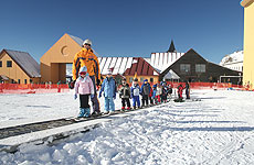 Children hop on the carpet at Cardrona and get drawn into the fun of the snowfield. Children hop on the carpet at Cardrona and get drawn into the fun of the snowfield.