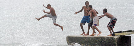 Young local boys in the Vanuatu capital of Port Vila enjoy an afternoon swimming and basking in the tropical island heat. Photo / Derek Cheng Young local boys in the Vanuatu capital of Port Vila enjoy an afternoon swimming and basking in the tropical island heat. Photo / Derek Cheng