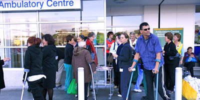 Patients and staff are waiting outside North Shore Hospital after a burst water pipe flooded the basement. Photo / Martin Sykes Patients and staff are waiting outside North Shore Hospital after a burst water pipe flooded the basement. Photo / Martin Sykes