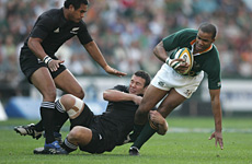 JP Pietersen (R) of South Africa is tackled by Aaron Mauger (C) and Isaia Toeva. Photo / Getty Images JP Pietersen (R) of South Africa is tackled by Aaron Mauger (C) and Isaia Toeva. Photo / Getty Images