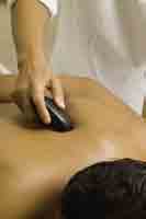 Enjoying the relaxing delights of a hot stone massage. Enjoying the relaxing delights of a hot stone massage.