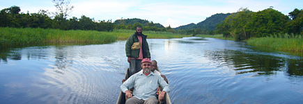 A few of the canoes on the Sepik River are driven by outboard motors these days, but the villages scattered along the river banks are still built in traditional styles. Photo / Jim Eagles A few of the canoes on the Sepik River are driven by outboard motors these days, but the villages scattered along the river banks are still built in traditional styles. Photo / Jim Eagles