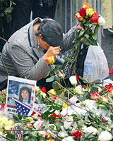 A woman pauses at the World Trade Center site. Photo / Reuters A woman pauses at the World Trade Center site. Photo / Reuters