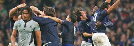 French players celebrate victory as the All Blacks' Rodney So'oialo walks away in despair. Photo / Getty Images French players celebrate victory as the All Blacks' Rodney So'oialo walks away in despair. Photo / Getty Images