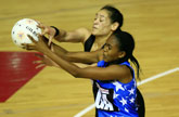 Botlhale Moeng (front) and Sheryl Scanlon (top) in action during the Silver Ferns' match against Botswana. Photo / Martin Sykes Botlhale Moeng (front) and Sheryl Scanlon (top) in action during the Silver Ferns' match against Botswana. Photo / Martin Sykes