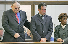 Shipton comforts Schollum during their sentencing for the 1989 rape. Photo / Mark Mitchell Shipton comforts Schollum during their sentencing for the 1989 rape. Photo / Mark Mitchell