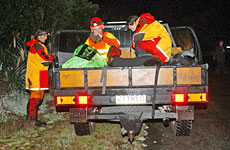 Search and Rescue team members head back to base after recovering another body from the river area. Photo / Sarah Ivey Search and Rescue team members head back to base after recovering another body from the river area. Photo / Sarah Ivey