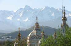 The Tien Shen Mountains behind Almaty in Kazakhstan. In the foreground is a cathedral. Photo / Jill Worrall The Tien Shen Mountains behind Almaty in Kazakhstan. In the foreground is a cathedral. Photo / Jill Worrall