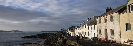 Neat little cottages cluster round a bay in the fishing village of Portnahaven, on the Island of Islay. A seal or two have been known to hang around, basking in the sun, here too. Photo / Jim Eagles Neat little cottages cluster round a bay in the fishing village of Portnahaven, on the Island of Islay. A seal or two have been known to hang around, basking in the sun, here too. Photo / Jim Eagles