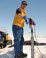 David Dempsey operates an ice core drilling machine at McMurdo Sound. David Dempsey operates an ice core drilling machine at McMurdo Sound.