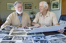 George Lowe and Ed Cotter, a colleague on the first New Zealand expedition to the Himalayas, study photos from the journey. Photo / Simon Baker George Lowe and Ed Cotter, a colleague on the first New Zealand expedition to the Himalayas, study photos from the journey. Photo / Simon Baker