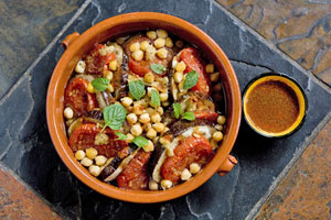 Eggplant, tomato and chickpea tagine with harissa. Photo / Babiche Martens Eggplant, tomato and chickpea tagine with harissa. Photo / Babiche Martens