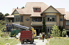 Crew work on the house. Photo / Janna Dixon Crew work on the house. Photo / Janna Dixon