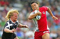 Tonga's Eddie Paea outruns Scot Iain Morrison to score. Photo / Getty Images Tonga's Eddie Paea outruns Scot Iain Morrison to score. Photo / Getty Images