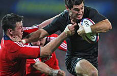 Stephen Donald goes in for the All Blacks' only try of the first half against Munster. Photo / Getty Images Stephen Donald goes in for the All Blacks' only try of the first half against Munster. Photo / Getty Images