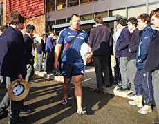 All Black prop John Afoa walks through a line of Harrow School students before training. Photo / Getty Images All Black prop John Afoa walks through a line of Harrow School students before training. Photo / Getty Images