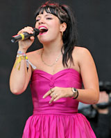 Lily Allen does pink chic at Glastonbury. Photo / AP Lily Allen does pink chic at Glastonbury. Photo / AP
