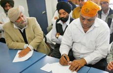 Ajit Randhawa (left) speaks to members during a gathering at a Sikh Temple discussing a trust fund to help with legal costs for Virender Singh (right). Photo / Greg Bowker Ajit Randhawa (left) speaks to members during a gathering at a Sikh Temple discussing a trust fund to help with legal costs for Virender Singh (right). Photo / Greg Bowker