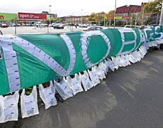 A banner with hundreds of signatures and messages from GetReal supporters, displayed outside a Countdown supermarket in Christchurch. Photo / Simon Baker A banner with hundreds of signatures and messages from GetReal supporters, displayed outside a Countdown supermarket in Christchurch. Photo / Simon Baker