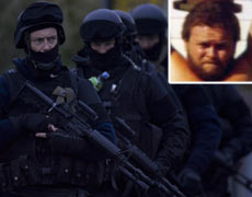 Armed Offenders Squad members outside Jan Molenaar's house today, and (inset) Jan Molenaar. Photos / Sarah Ivey Armed Offenders Squad members outside Jan Molenaar's house today, and (inset) Jan Molenaar. Photos / Sarah Ivey
