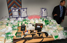 Detective Inspector Bruce Good stands next to New Zealand's largest drug haul, $95 million worth of methamphetamine, plus arms and ammunition found in a house raid. Photo / Paul Estcourt Detective Inspector Bruce Good stands next to New Zealand's largest drug haul, $95 million worth of methamphetamine, plus arms and ammunition found in a house raid. Photo / Paul Estcourt
