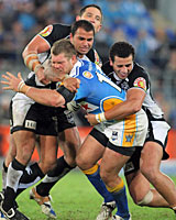 Michael Henderson of the Titans takes on the Warriors defence. Photo / Getty Images Michael Henderson of the Titans takes on the Warriors defence. Photo / Getty Images