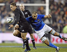 All Black first-five Luke McAlister loses the ball in a tackle during last night's test against Italy. Photo / Getty Images All Black first-five Luke McAlister loses the ball in a tackle during last night's test against Italy. Photo / Getty Images