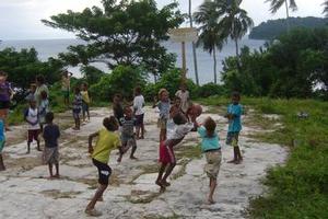 Children on the island of Pentecost play basketball court at the Latano Catholic Mission. Photo / Catherine Masters
