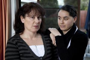 Denise Clarke, with daughter Jenna, is delighted with the judge's decision over the body of her husband, James Takamore, but uncertain about her next move. Photo / Simon Baker