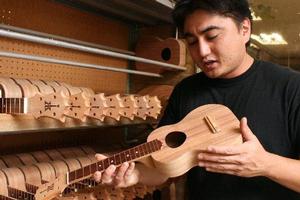 Brian Benavente at the Ko Aloha ukulele factory in Honolulu, Hawaii. Photo / Jim Eagles