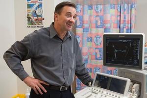 Starship hospital cardiologist Nigel Wilson with an echocardiogram that measures heart performance. Photo / Paul Estcourt