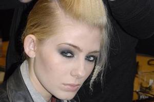 A model has her hair and makeup done backstage at Sera Lilly. Photo / Nicole Saunders
