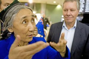 Rebiya Kadeer was greeted at Auckland Airport yesterday by her host, Green MP Keith Locke (rear). Photo / Richard Robinson