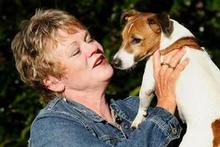 Lisa Jackson and her beloved dog Ellie on whom she spent around NZD$8000 after she was attacked and mauled by a neighbour's dog earlier this year. Photo / Kenny Rodger Lisa Jackson and her beloved dog Ellie on whom she spent around NZD$8000 after she was attacked and mauled by a neighbour's dog earlier this year. Photo / Kenny Rodger