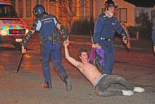One of the 67 people arrested in the Undie 500 riots is dragged away from Castle St. Photo / Otago Daily Times One of the 67 people arrested in the Undie 500 riots is dragged away from Castle St. Photo / Otago Daily Times