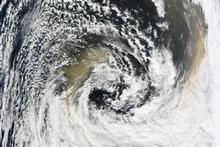 This satellite image shows the red dust that blew across New South Wales mixing with heavy cloud over the Tasman. Photo / NASA This satellite image shows the red dust that blew across New South Wales mixing with heavy cloud over the Tasman. Photo / NASA