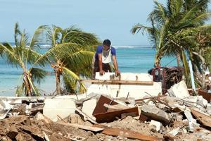 A villager stands amid the rubble at a tsunami-hit part of Samoa's southeastern coast. Photo / Brett Phibbs