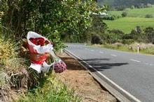 Flowers mark the spot on Peak Rd, Helensville, where Graham Robinson was knocked off his bicycle. Police are still hunting for the driver of the white Toyota Hilux involved in the incident. Photo / Brett Phibbs Flowers mark the spot on Peak Rd, Helensville, where Graham Robinson was knocked off his bicycle. Police are still hunting for the driver of the white Toyota Hilux involved in the incident. Photo / Brett Phibbs