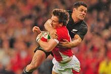 Dan Carter has been handed a one-match ban for a dangerous high tackle on Wales halfback Martin Roberts. Photo / Getty Images Dan Carter has been handed a one-match ban for a dangerous high tackle on Wales halfback Martin Roberts. Photo / Getty Images