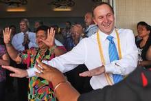 John Key gets into the swing of things at the Matavai Resort on Niue. Photo / Getty Images John Key gets into the swing of things at the Matavai Resort on Niue. Photo / Getty Images