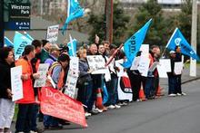 Lines engineers picket Telecom House in Ponsonby in a protest against the new contracts. Photo / Martin Sykes Lines engineers picket Telecom House in Ponsonby in a protest against the new contracts. Photo / Martin Sykes