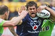 Warriors stand-off Joel Moon takes on the Canberra defence during today's game in Auckland. Photo / Getty Images Warriors stand-off Joel Moon takes on the Canberra defence during today's game in Auckland. Photo / Getty Images